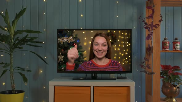 Smiling Woman on a Videocall Wishing a Merry Christmas Online