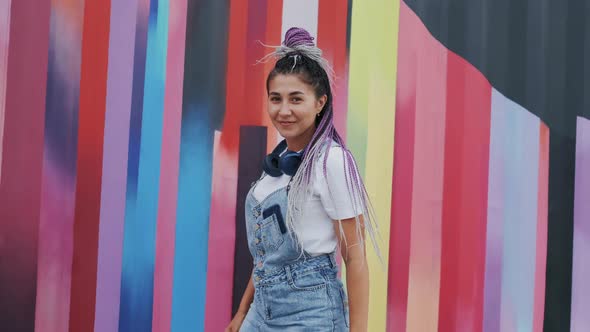 Pretty Happy Adult Girl in Denim Overalls Smiling and Looking in Camera alt