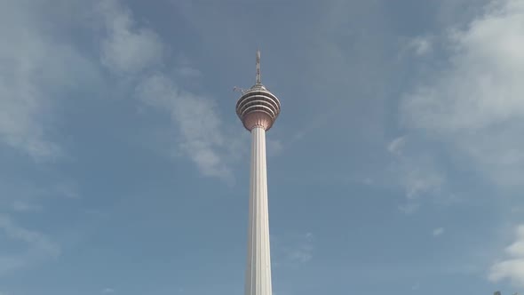 Menara Kuala Lumpur Malaysia seen from road, low and steady shoot with clear blue sky