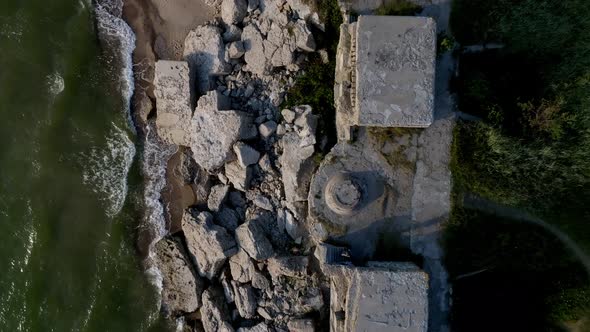 Ruins of Bunkers on the Beach of the Baltic Sea Part of an Old Fort in Liepaja alt