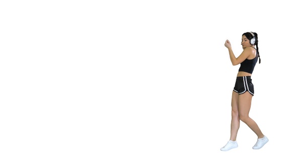Young Happy Sportive Woman Dancing and Listening to Music alt