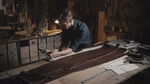 Young Professional Tailor Making Leather Belts at His Workshop Creating Handmade Original alt