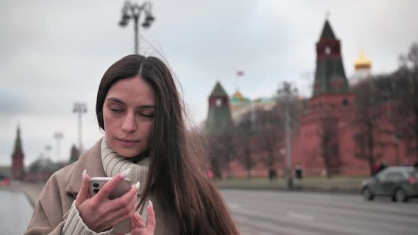 Beautiful Young Brunette Woman in White Dress Calling By Phone, Summer Street Outdoors alt