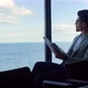 Businessman Reading Contract Papers at Sea View - VideoHive Item for Sale
