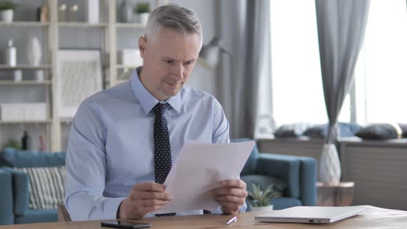 Positive Gray Hair Businessman Reading Documents Contract alt