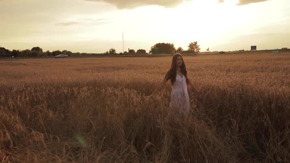 Gorgeous Brunette Walking in the Field.