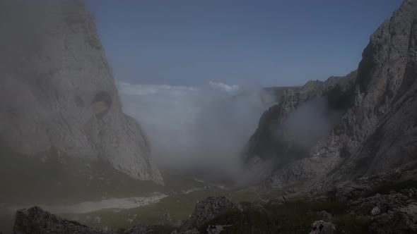 Time Lapse of Fog Shimmers in a Mountain Valley.
