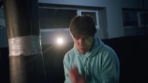 Alone Boxer Improves Boxing Movements in Dark Gym in Slow Motion alt