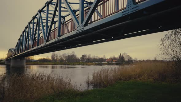 Walk Along the Bridge Over the River on an Autumn Evening