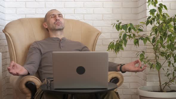 Man Reducing Stress at Work Place alt
