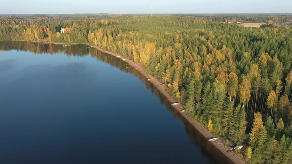 The Aerial View of the Trees on the Side of Lake Saimaa in Finland alt
