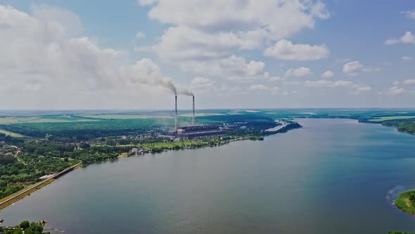 Beautiful scenery of the river background and plant with pipes. Natural landscape of blue water alt