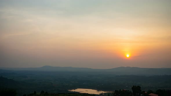 time lapse fluffy fog cloud flowing on natural forest mountain from sunset cloudy sky alt