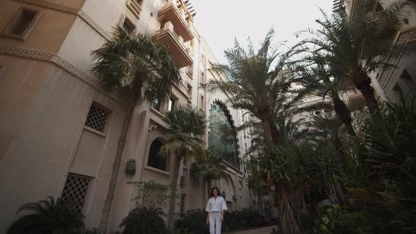 Woman Walking in Luxury Residential Neighborhood in Dubai alt