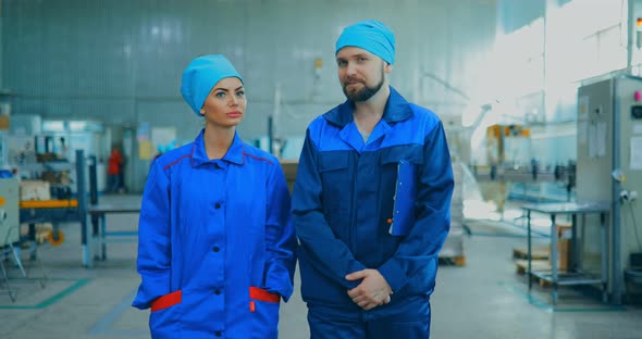 Workers are Walking Around the Territory of the Chemical Plant for the Production of Household alt