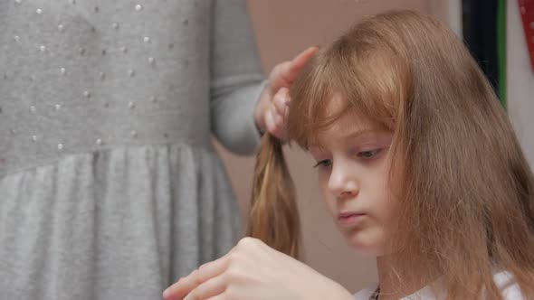 Woman Combing Girl alt