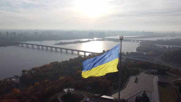 state flag and Dnieper river in Kyiv, Ukraine. zoom out