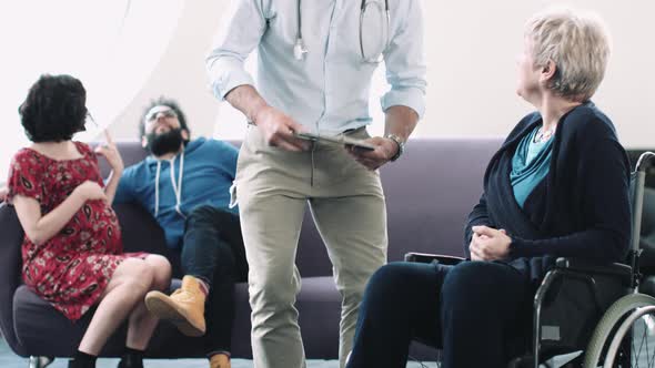 Doctor consulting patient in hospital waiting room