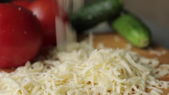 Slices of Cheddar and Colby Cheese Disappearing From a Stack on a Cutting Board Stop Motion