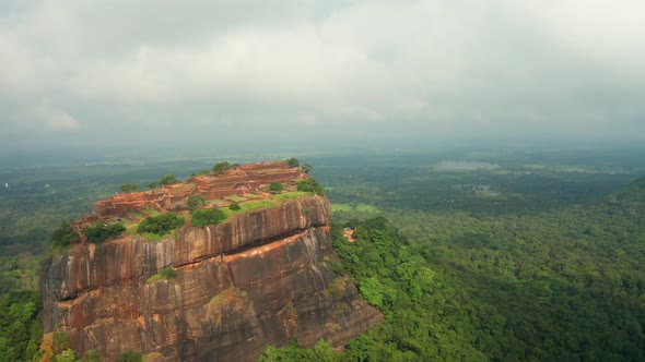 Aerial View of the Holy Mountain Sigiriya. Circling Around the Mountain Through the Clouds. Mountain