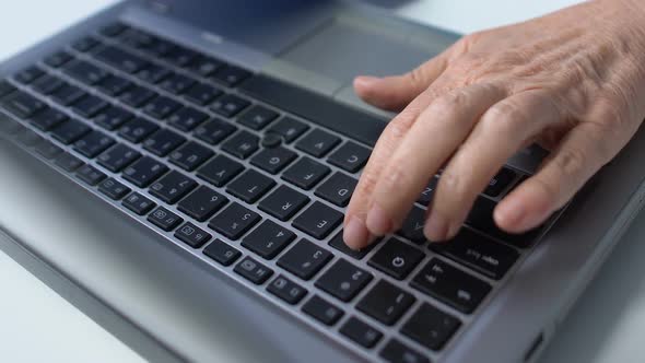 Elderly Woman Typing on Laptop, Studying Modern Program for Senior People