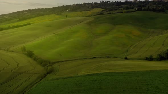 Flying over the amazing rolling hills of Tuscany Italy alt