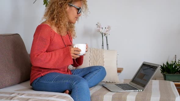 Modern technology adult woman at home with laptop computer internet connected alt