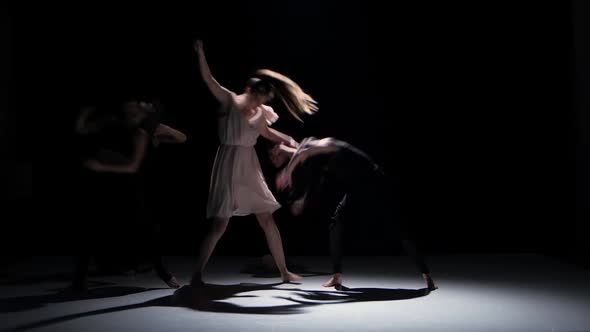 Continue of Contemporary Dance Performance of Five Dancers on Black, Shadow alt