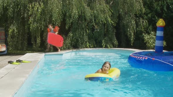 Kids Jumping in Swimming Pool Slo Mo