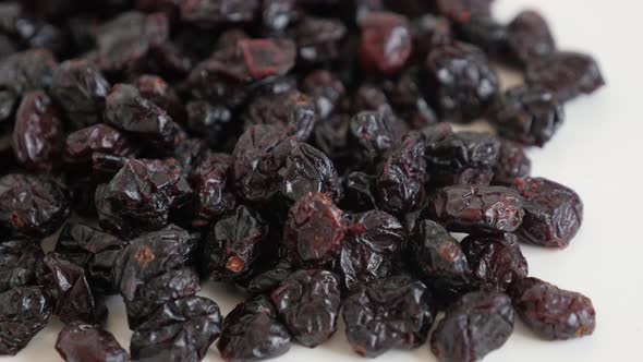 Heap of Vaccinium oxycoccos berries slow tilt 4K 2160p 30fps UltraHD footage - Sweetened and  dehydr alt