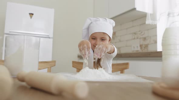 Kid Sprinkle the Dough with Flour Smiles Happy alt