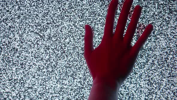 Blooded Hand Touching Old Retro Television Screen with Ripples Wavy Flowing Damaged Signal alt