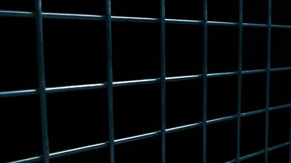 Metal Grid Fence In Dark Area alt