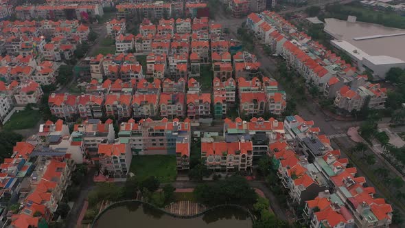 Foggy,smoggy early morning drone footage over urban villa housing developments in district seven Sai alt