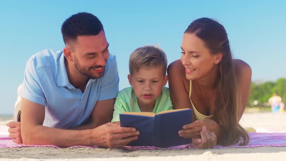 Family Reading Book on Summer Beach alt