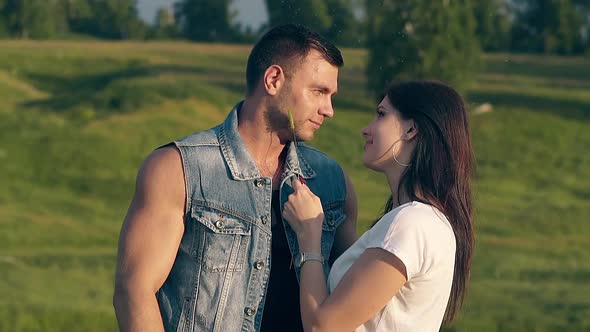 Close View Young Brunette Woman Runs Wheat on Man Cheek Chin alt