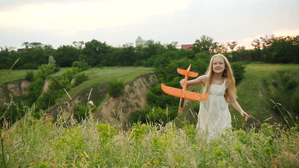 Child Girl Playing With The Toy Airplane 2 alt