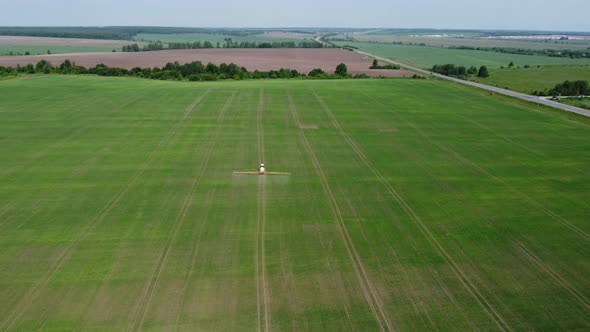 Processing of Agricultural Fields with Fertilizers and Pesticides From Weeds and Pests