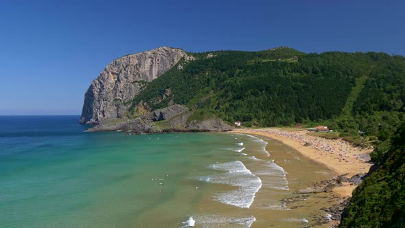 playa-de-laga-beach-spain-foamy-waves-of-turquoise-ocean-waters