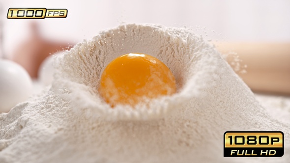 Egg Yolk Rolling Down the Pile of Flour alt