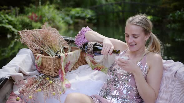 Happy Young Woman On A Rowing Boat Drinking A Glass Of Wine Relaxing - Medium Shot alt