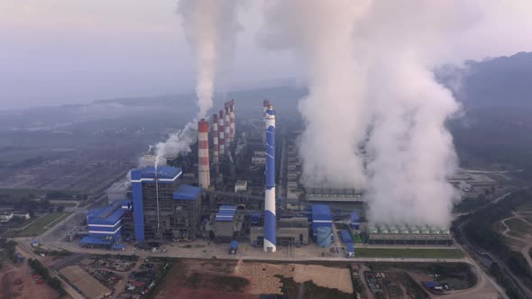 Aerial view of Mae Moh Coal Power Plant with smoke and toxic air from chimney. alt