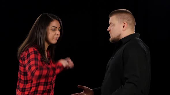 Irritated Woman Yells and Outraged. Isolated on Black Background. Close-up alt