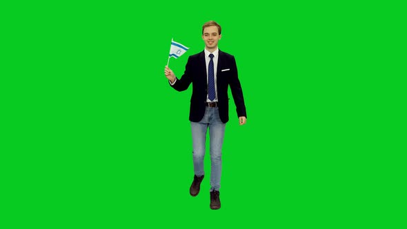Young Businessman Walking with Waving Flag of Israel on Green Screen 