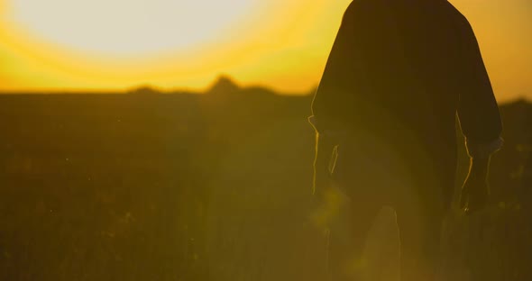 Farmer Walking on Field alt