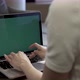 Person Typing Keyboard Of Laptop With Green Screen - VideoHive Item for Sale