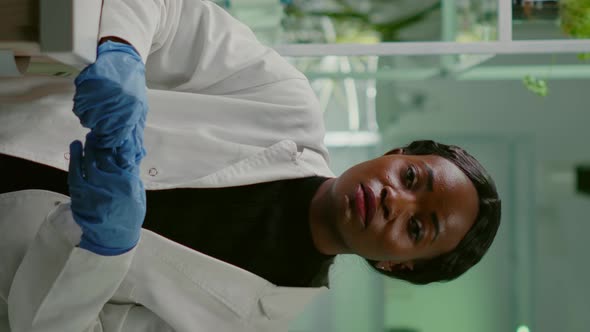 Vertical Video Pov of Botanist Researcher Woman Explaining Botany Experiment During Online Videocall alt