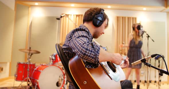 Music band performing in a studio alt