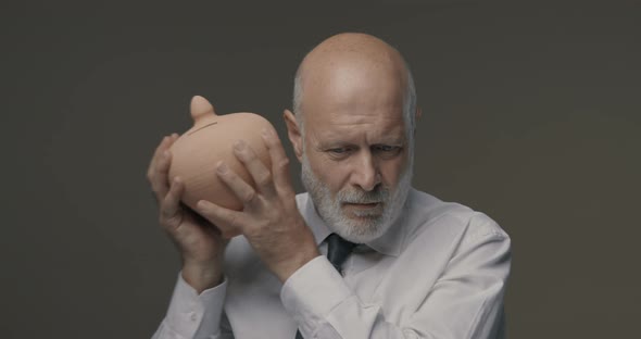 Senior businessman checking his savings