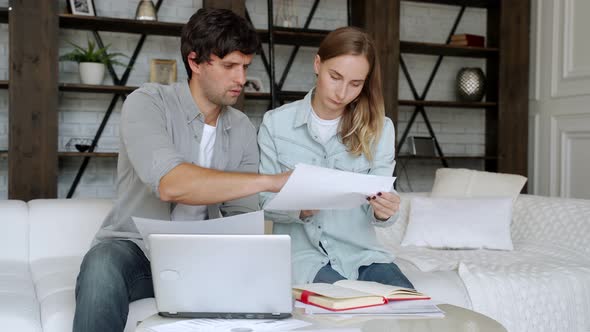 Young Couple Paying Bills Online in Computer App alt